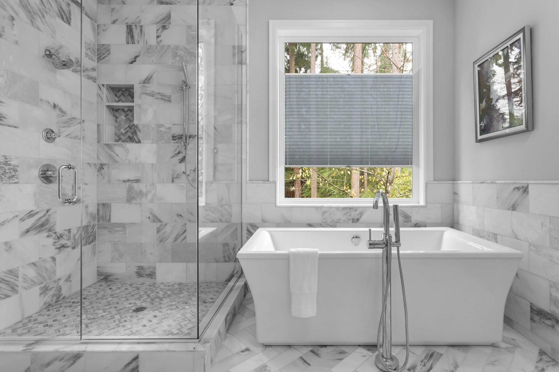 Bathroom with bathtub and shower in new luxury home with all gla