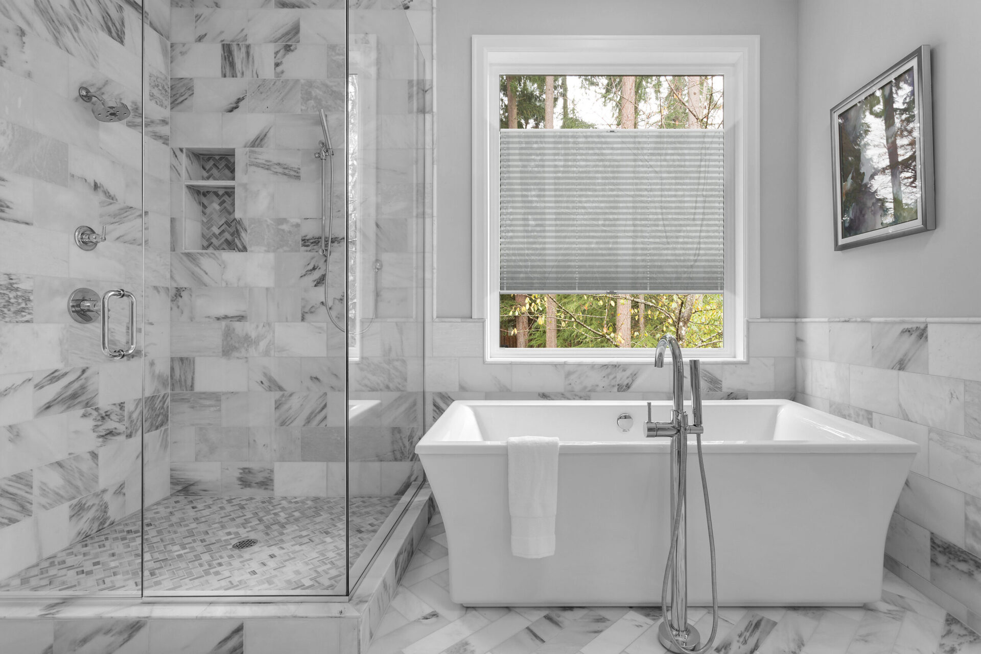 Bathroom with bathtub and shower in new luxury home with all gla